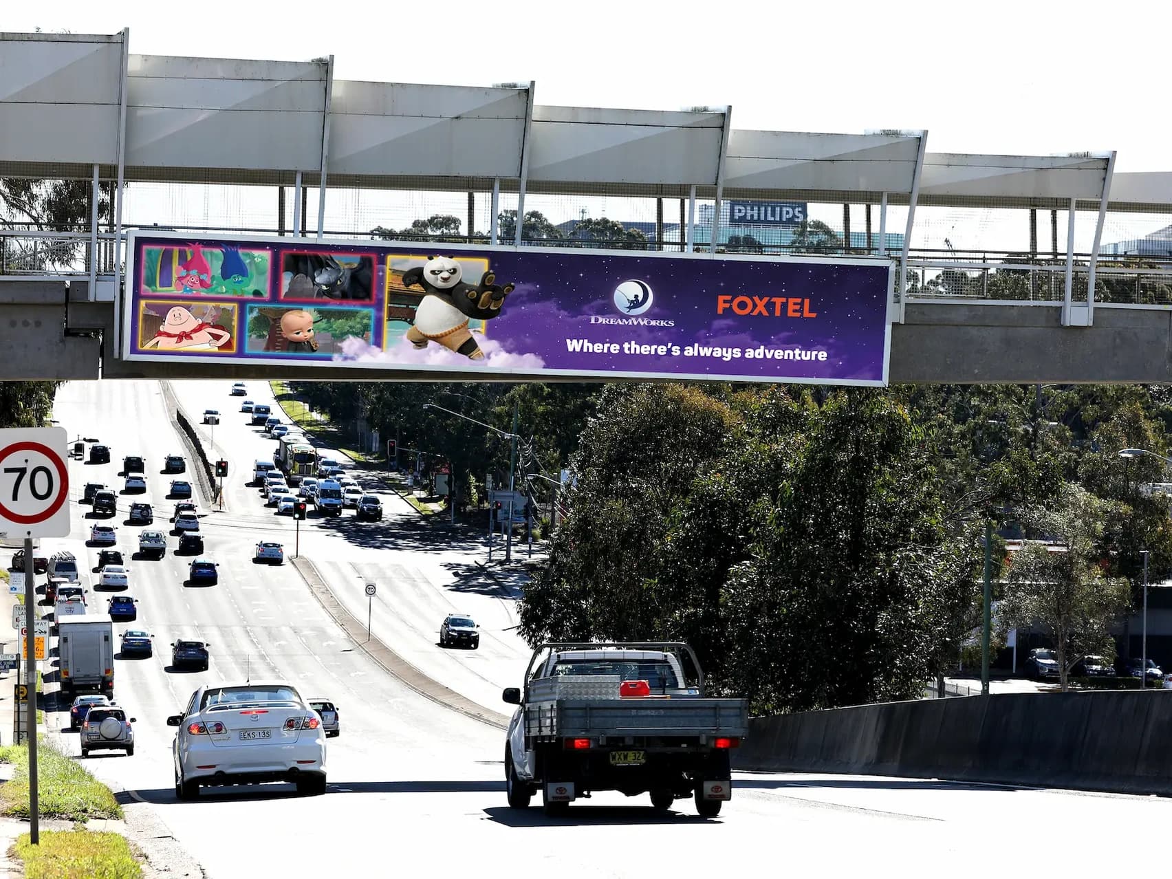 The finished World Windows campaign displayed on a roadside billboard in Australia
