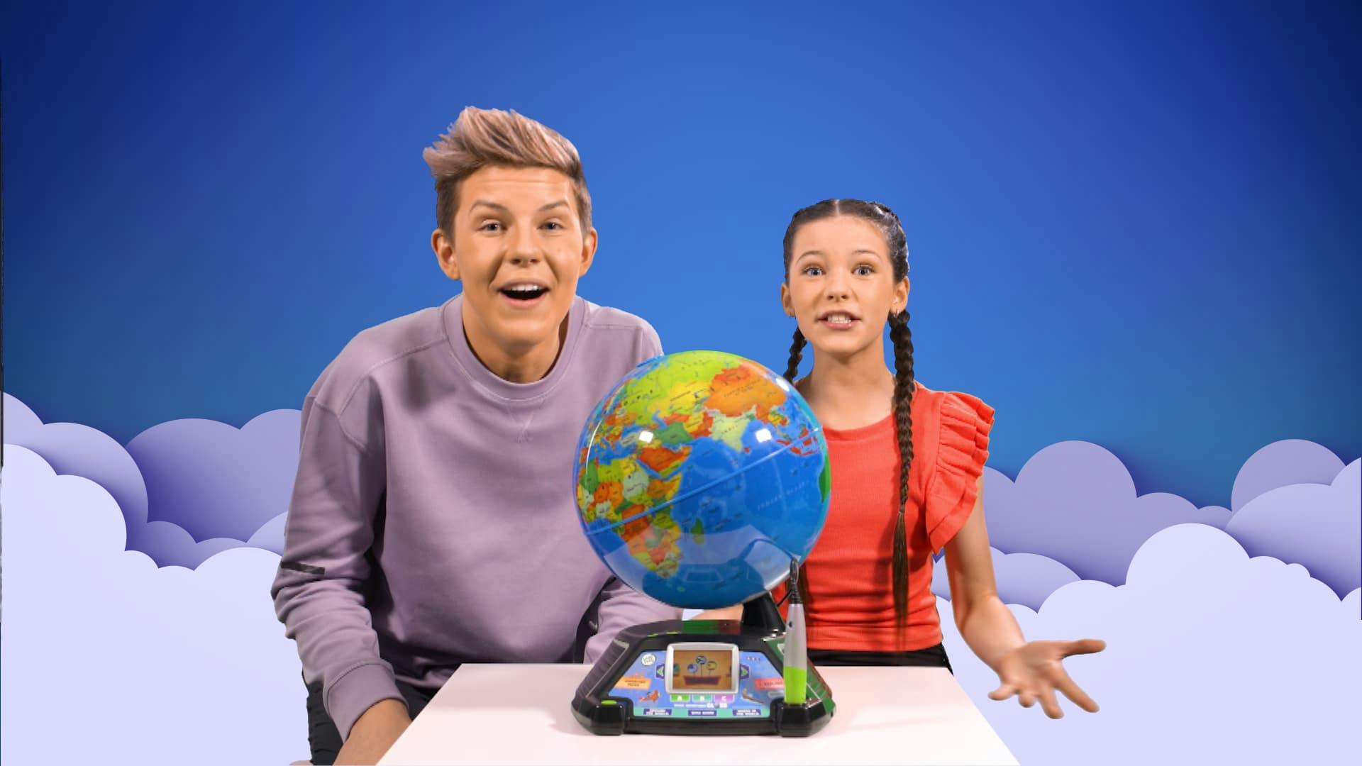 Presenters Prezley and Miss Charli play with a Vtech Globe.